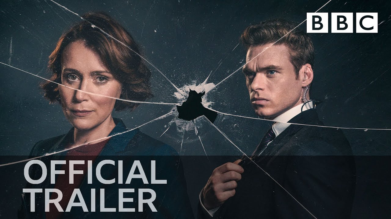 [Image is a promo image of Bodyguard. It shows a woman and a man. There's a bullet hole through glass that separates them]